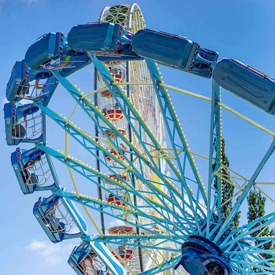 Picture of Sky Scraper and Screamer in action at Lagoon Amusement Park. Screamer is in the foreground with Sky Scraper in the background.