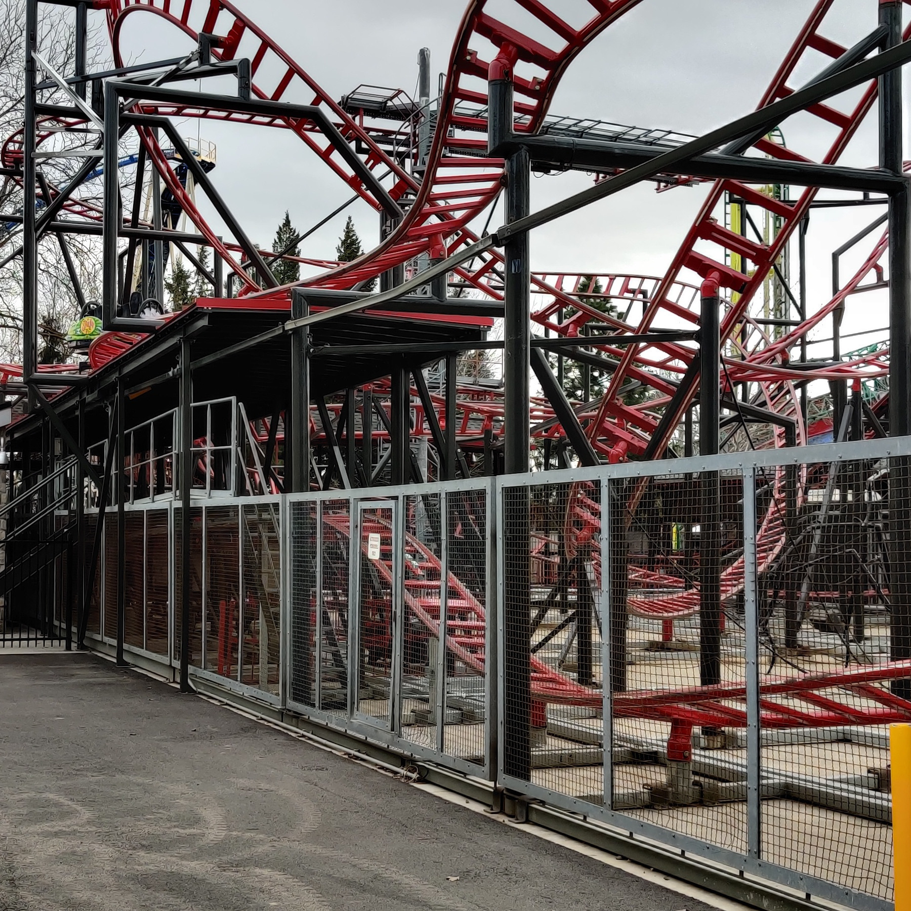 The Spider at Lagoon Amusement Park taken during the off-season just before the park opened from the Biergarten walkway. One of the ride vehicles can be seen sitting on the track above the station.