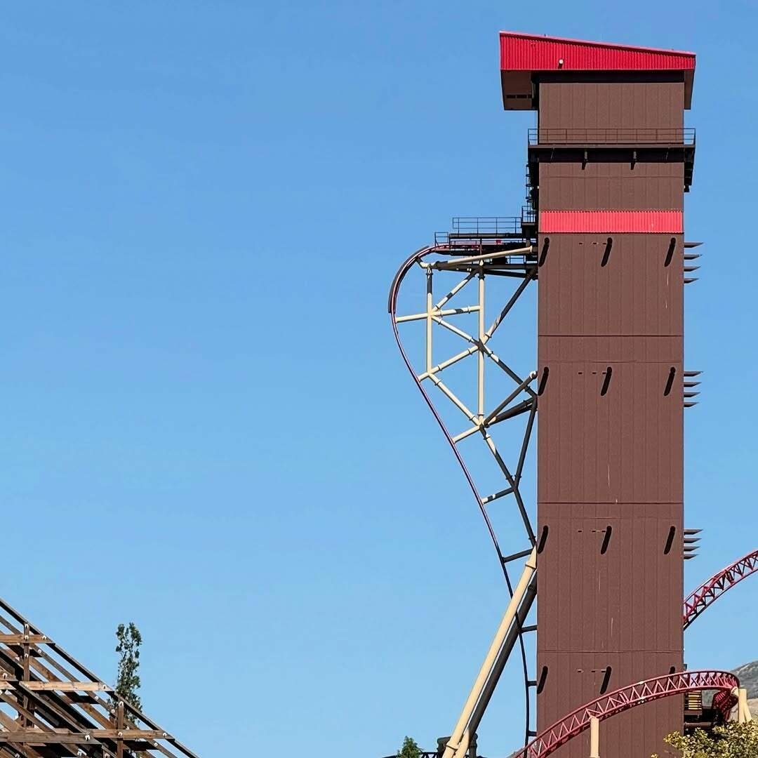 An image of Cannibal tower and first drop from the South side looking north with clear blue sky in the background.