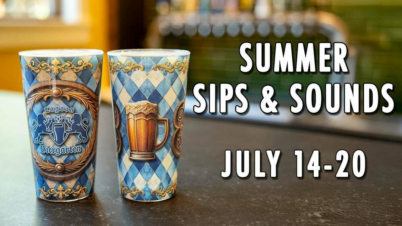 Two ornate beer steins sit side by side on a counter, decorated in blue and white diamond patterns with gold trim. One cup reads “Lagoon Biergarten” and features a heraldic crest with two lions; the other displays an illustration of a frothy beer mug. Behind them, the blurred background reveals bar taps and a hint of the venue’s interior. Text on the right side announces: “SUMMER SIPS & SOUNDS JULY 14–20,” hinting at a festive event.